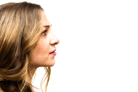 Portrait of Beautiful Young Woman Over White Backgroundの写真素材