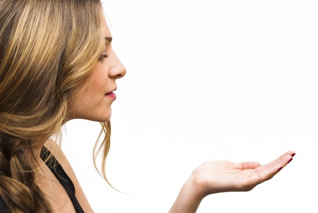 Portrait of Beautiful Young Woman  With His Open Hand Over White Backgroundの写真素材