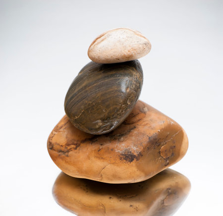 Three Piled Stones on a Mirror