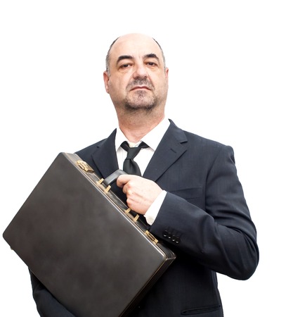 Businessman carrying a briefcase over whiteの写真素材