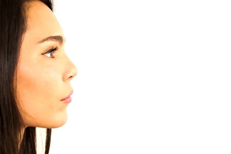 Portrait of Beautiful Young Woman Over White Backgroundの写真素材