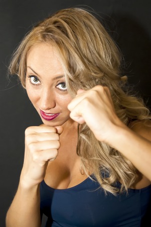 Portrait of Beautiful Young Woman Over Black Backgroundの写真素材