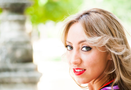 Portrait of Beautiful Young Woman In The Parkの写真素材