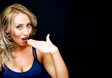 Portrait of Beautiful Young Woman Over Black Backgroundの写真素材