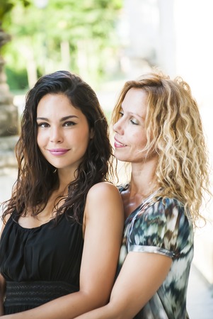 Portrait of Beautiful Young Woman and beautiful Middle Aged Woman  In The Park, that are mother and daughterの写真素材