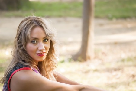 Portrait of Beautiful Young Woman In The Parkの写真素材