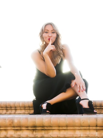 Portrait of beautiful woman backlitの写真素材