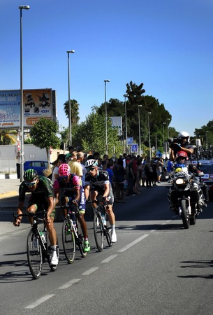 SEVILLA, SPAIN - AUGUST 26, 2015: Runners bike in the championship of the Tour of Spain on his arrival in Seville on August 26, 2015, Sevilla, Spainのeditorial素材