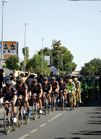 SEVILLA, SPAIN - AUGUST 26, 2015: Runners bike in the championship of the Tour of Spain on his arrival in Seville on August 26, 2015, Sevilla, Spainのeditorial素材