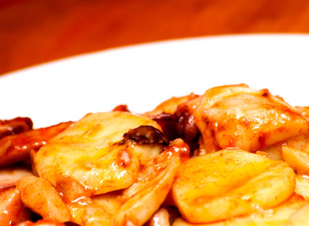 Octopus with paprika on a white plate, also known as Galician octopus, typical plate of Spain