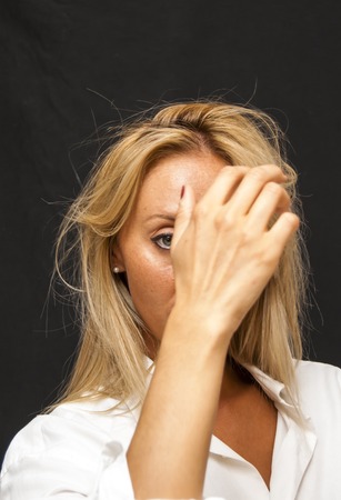 Portrait of Sexy Young Woman with a white shirt man Over Black Backgroundの写真素材