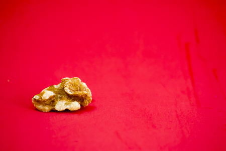 Nuts isolated on red background.の写真素材
