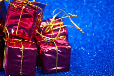 Gift packages for a party such as Christmas or birthday on bright blue background