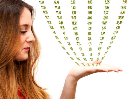 Portrait of young beautiful woman with her open hand on which there are numbers on white backgroundの写真素材