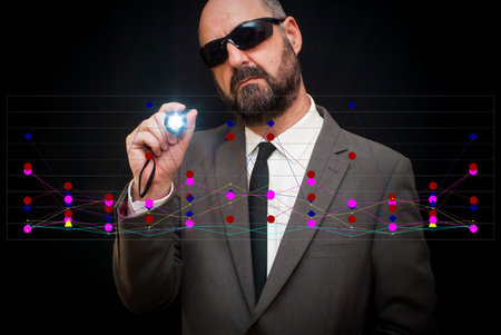 Handsome business man, bald and beard, with sunglasses and with a lighted lantern in his hand...