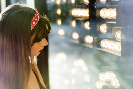 Portrait of a beautiful woman  in the street window shoppingの写真素材
