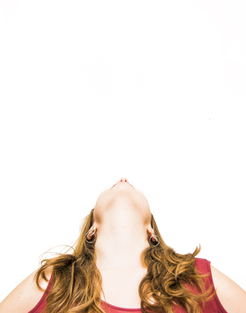 Beauty Woman Looking Up Portrait Isolated over White Backgroundの写真素材