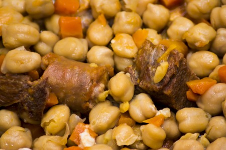 Madrid stew on a plate on a wooden table, typical food from Spainの写真素材