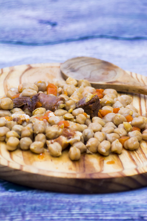 Madrid stew on a plate on a wooden table, typical food from Spainの写真素材