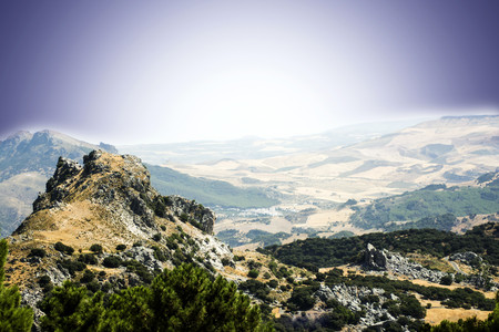 Landscape of mountains with fields planted in the backgroundの写真素材