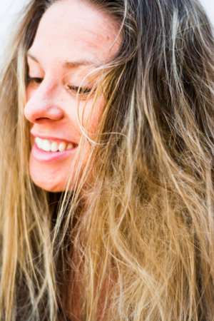 Portrait of the face of a beautiful blond woman on white background