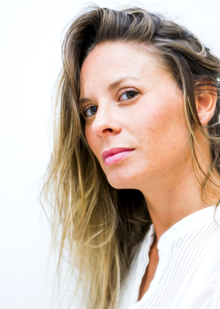 Portrait of the face of a beautiful blond woman on white backgroundの写真素材