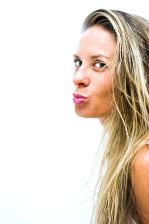 Portrait of the face of a beautiful blond woman on white backgroundの写真素材