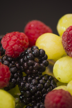 Varied fruit, blackberry, raspberry and grapesの写真素材