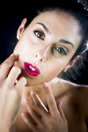 Beautiful woman on black backgroundの写真素材