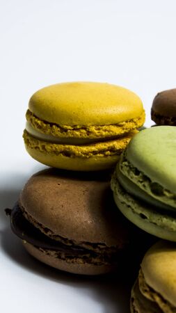 Colored macarons isolated on white background, typical French dishの写真素材