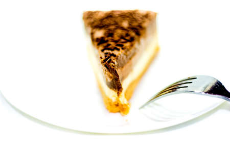 Portion of delicious chocolate cake on white backgroundの写真素材