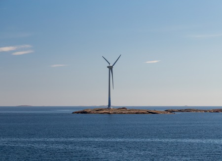 Finland Aland, Islands of Lilla Batskar outside Aland with wind mills on a sunny spring day and calm seaの写真素材
