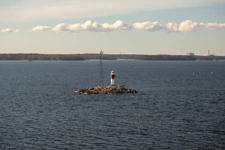 Finland, Archipelago of Turku, lighthouse Rajakari at the seaway that divides the route to Naantali and Turku on a spring dayの写真素材