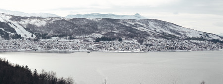 Panorama Norway Ankenes, seen from Narvik side of the bay, on a winter day, lot of houses at the mountain sideの写真素材