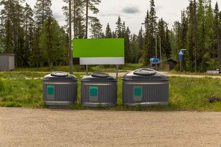 Luosto Finland, recycle bins on the side of a parking lot on a summer dayの写真素材