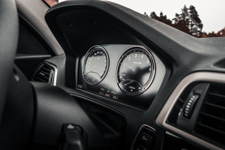 Inside view from a modern car instrument panel with gauges