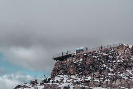 Editorial 09.07.2019 Dalsnibba Norway, tourists at the landscape observation deck looking at the views at the topのeditorial素材