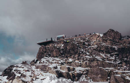 Editorial 09.07.2019 Dalsnibba Norway, tourists at the landscape observation deck looking at the views at the topのeditorial素材