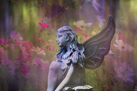 Fairy statue with flowersの写真素材