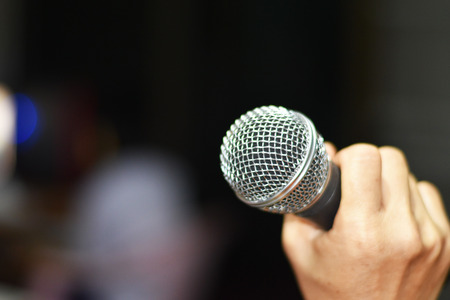 hand holding the microphoneの写真素材