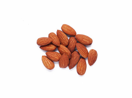 Almond nut pile on white backgroundの写真素材