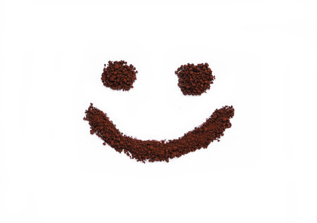 Coffee powder made smiling face shape on white backgroundの写真素材
