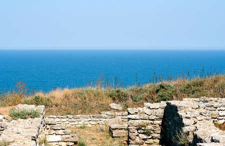 Rocky seashore woth the view on horizonの写真素材