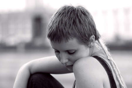 Nice young sad girl in the cityの写真素材