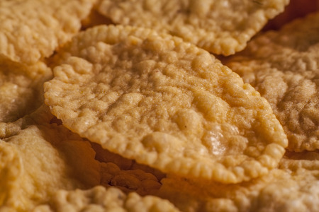 Close-up of Corn flake amids other flakesの写真素材