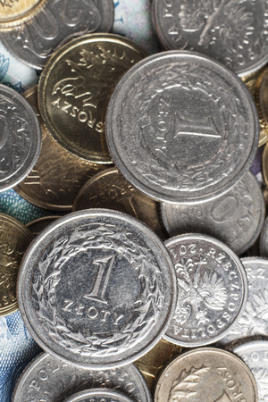 Two one zloty coins on onther polish coins and billsの写真素材