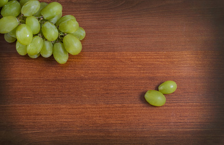 Green grape bunch on tableの写真素材