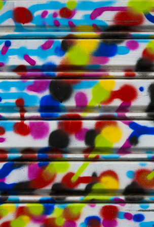 Abstract painting on the metal gateの写真素材