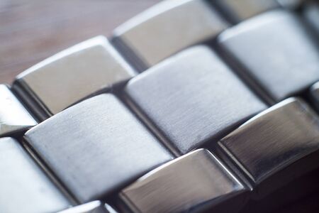 Macro closeup on links of stainless steel watch metal bandの写真素材