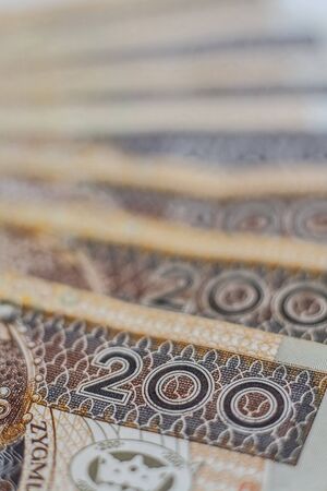 Macro closeup of number 200 on two hundred zloty polish banknotes arrenged in rowの写真素材